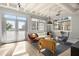 Airy living room bathed in sunlight, offering comfortable seating arrangements and views from the large windows at 805 Peachtree Ne St # 220, Atlanta, GA 30308