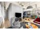 Spacious living area with modern furnishings, an entertainment unit, and a glimpse of the eat-in kitchen at 805 Peachtree Ne St # 220, Atlanta, GA 30308