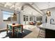 Sunlit open-concept living space with a modern kitchen, dining area, and comfortable seating with large windows at 805 Peachtree Ne St # 220, Atlanta, GA 30308