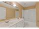 Bathroom features a double sink vanity, updated lighting and tile flooring at 861 Southland Pass, Stone Mountain, GA 30087