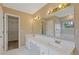 Bathroom features a double sink vanity with white countertops and tile floors at 861 Southland Pass, Stone Mountain, GA 30087
