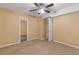 Bedroom with carpeted floor, ceiling fan, and neutral paint, ready for customization at 861 Southland Pass, Stone Mountain, GA 30087