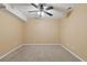 The empty bedroom offers ample space, carpeting, and neutral walls with a ceiling fan at 861 Southland Pass, Stone Mountain, GA 30087