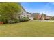 Charming home with a well-kept lawn and mature landscaping, creating great curb appeal for this residence at 861 Southland Pass, Stone Mountain, GA 30087