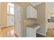 Hallway includes a built in desk, cabinets, and tiled floors leading into the kitchen at 861 Southland Pass, Stone Mountain, GA 30087