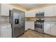 Modern kitchen design showcases white cabinets and stainless steel appliances at 861 Southland Pass, Stone Mountain, GA 30087