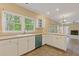 Open kitchen layout with view to the living room, features tile floors and outdoor view at 861 Southland Pass, Stone Mountain, GA 30087