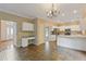 Open floor plan view of the kitchen featuring white cabinets, stainless appliances, and breakfast bar at 861 Southland Pass, Stone Mountain, GA 30087