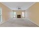 Cozy living room features a traditional fireplace and large windows for natural light at 861 Southland Pass, Stone Mountain, GA 30087
