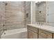Bathroom featuring stylish tile shower and a wooden vanity at 140 Rolison Way, Fayetteville, GA 30214