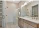 Bathroom featuring a double vanity, glass shower, and tile flooring at 140 Rolison Way, Fayetteville, GA 30214