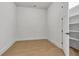 Bedroom featuring light hardwood flooring and a walk in closet at 140 Rolison Way, Fayetteville, GA 30214
