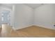 Bedroom featuring light hardwood flooring and a hallway entrance at 140 Rolison Way, Fayetteville, GA 30214