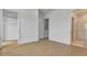 Bright bedroom featuring hardwood floors, closet, and a bathroom with glass shower at 140 Rolison Way, Fayetteville, GA 30214