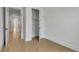 Bedroom with hardwood flooring and white closet located next to a hallway at 140 Rolison Way, Fayetteville, GA 30214