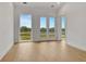 Bedroom features hardwood floors and glass-paned doors at 140 Rolison Way, Fayetteville, GA 30214