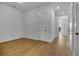 Bedroom featuring light hardwood flooring and a hallway entrance at 140 Rolison Way, Fayetteville, GA 30214