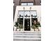 Stylish boutique entrance with modern planters, clean lines, and decorative outdoor lighting at 140 Rolison Way, Fayetteville, GA 30214