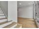 Entryway with hardwood floors, stairs, and a glass-paned door at 140 Rolison Way, Fayetteville, GA 30214