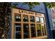 Boutique storefront with modern wood framed windows and exterior lighting at 140 Rolison Way, Fayetteville, GA 30214