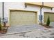 Double garage with stylish wooden doors and neat landscaping on a modern home exterior at 140 Rolison Way, Fayetteville, GA 30214