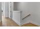 Hallway with hardwood floors and a view of the stairs at 140 Rolison Way, Fayetteville, GA 30214