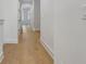 Hallway featuring light hardwood flooring and white trim at 140 Rolison Way, Fayetteville, GA 30214