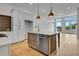 Kitchen featuring a center island with stainless steel appliances, modern cabinets, and an open floor plan at 140 Rolison Way, Fayetteville, GA 30214