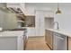 New kitchen with a stainless oven, decorative backsplash, hardwood floors and an island with sink and dishwasher at 140 Rolison Way, Fayetteville, GA 30214
