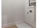 Small laundry room with tile flooring at 140 Rolison Way, Fayetteville, GA 30214