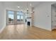 Bright living room with hardwood floors, fireplace, and access to the outdoors at 140 Rolison Way, Fayetteville, GA 30214