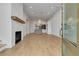 Spacious living room with hardwood floors, fireplace, and open layout into the kitchen at 140 Rolison Way, Fayetteville, GA 30214