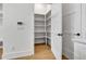 Walk-in pantry provides ample shelving and storage space at 140 Rolison Way, Fayetteville, GA 30214