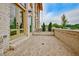 Brick patio with ample space and a partial view of the neighborhood from a stylish modern home at 140 Rolison Way, Fayetteville, GA 30214