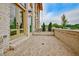 This outdoor brick patio features a private entrance and well-maintained landscaping at 140 Rolison Way, Fayetteville, GA 30214