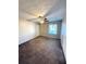 Bedroom featuring neutral carpet, a ceiling fan, a window, and a closet at 296 Country Club Dr, Jonesboro, GA 30238
