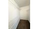 Walk-in closet with white wire shelving for organized storage at 296 Country Club Dr, Jonesboro, GA 30238