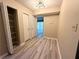 Bright entryway showcasing sleek flooring and ample closet space at 296 Country Club Dr, Jonesboro, GA 30238