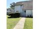 Inviting two-story home with tidy landscaping and a paved walkway to the entrance at 296 Country Club Dr, Jonesboro, GA 30238