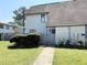 Charming home featuring a well-manicured lawn, garden bed, and inviting walkway to the front door at 296 Country Club Dr, Jonesboro, GA 30238