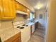 Cozy kitchen features updated countertops and wooden cabinetry at 296 Country Club Dr, Jonesboro, GA 30238