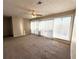 Large living room with big window and ceiling fan at 296 Country Club Dr, Jonesboro, GA 30238