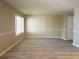 Bright living room featuring fresh paint, modern flooring, and abundant natural light at 296 Country Club Dr, Jonesboro, GA 30238