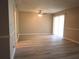 Spacious living room with modern flooring and natural light streaming in through sliding glass doors at 296 Country Club Dr, Jonesboro, GA 30238