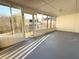 Sunroom with gray floor and many windows for lots of natural light at 296 Country Club Dr, Jonesboro, GA 30238