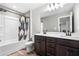 Modern bathroom featuring a double sink vanity, shower and tub combination, and stylish fixtures at 3020 Westgate Park Dr, Loganville, GA 30052
