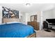 Comfortable bedroom features a bed, dresser, desk with a computer, and a gaming chair at 3020 Westgate Park Dr, Loganville, GA 30052