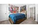 Bedroom with a platform bed, carpet, and wall art, adjacent to a hallway with a visible doorway at 3020 Westgate Park Dr, Loganville, GA 30052