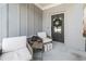 Cozy front porch featuring comfortable seating and a wreath on the front door at 3020 Westgate Park Dr, Loganville, GA 30052