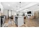 Modern kitchen with an island, granite countertops, and stainless steel appliances at 3020 Westgate Park Dr, Loganville, GA 30052